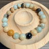 Multicolored beaded bracelet on a wooden surface