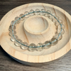Clear beaded bracelet on a wooden surface